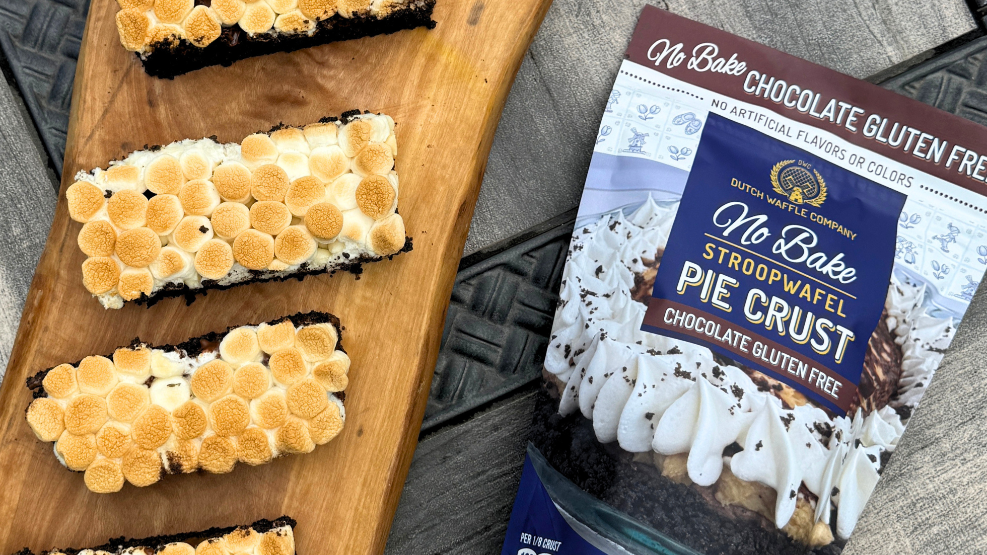 No Bake Chocolate Gluten Free Pie Crust package with s'mores bars on a wooden board.